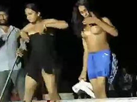 A seductive Asian beauty performs a nude dance