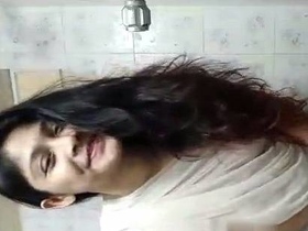 Nude Indian girl takes a bath in sari and selfie camera