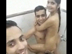 Twins from India have passionate sex with a girl in a bathroom