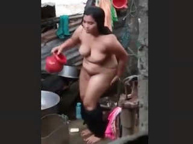 Indian beauty takes outdoor shower