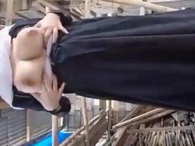 Indian woman in burka reveals her large breasts