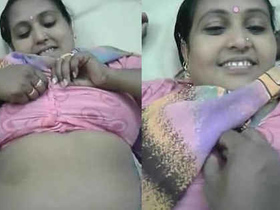 Attractive middle-aged woman in a saree and her superior engage in intimate activities