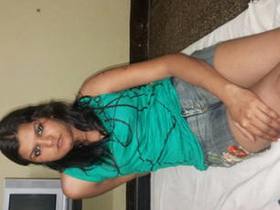 A professional woman in Goa engages in sexual activities while speaking with a client on her mobile phone
