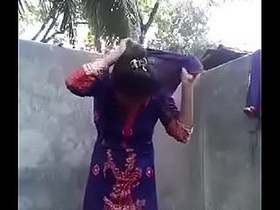 A Desi woman strips naked in front of her partner in the bathroom, uninhibited