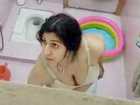 Desi bhabi bathes and pees on her mother in a village setting