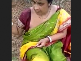 Mature couple enjoys outdoor sex in nature