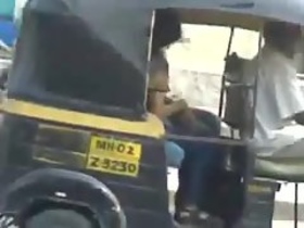 Auto rickshaw drivers share a passionate kiss in public